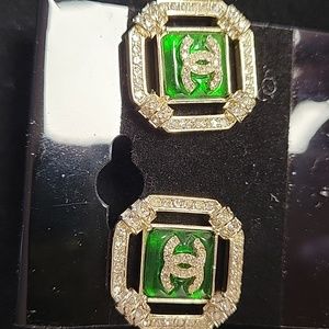 CC earring gold tone, with rhinestones & green backing
